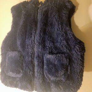 Tommy Hilfiger Child's fluffy black hooded vest. Size 2